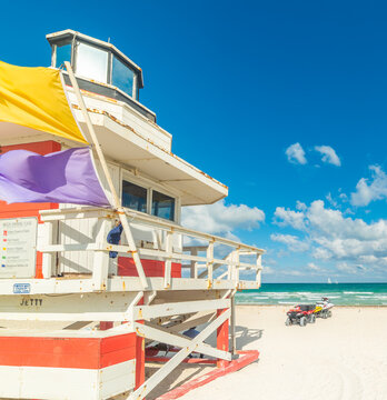 White and red lifeguard tower with rescue ATV and jet ski at Miami Beach