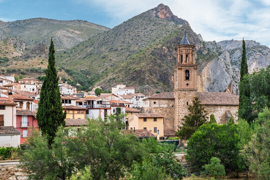 The church and village of Arnedillo in the Rioja region of Spain famous for it's thermal baths with mountains behind