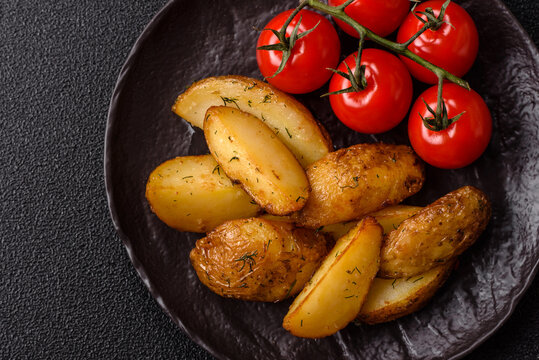 Fried potato wedges seasoned with salt and spices, ready for dinner table. Fried potato wedges