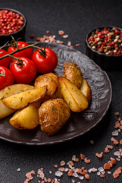 Fried potato wedges seasoned with salt and spices, ready for dinner table. Fried potato wedges