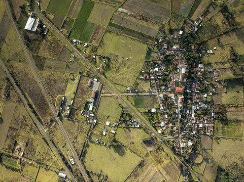 Aerial view of the town of Uranden de Morelos surrounded by agricultural fields and rural landscape in Uranden de Morelos, Michoacan, Mexico.