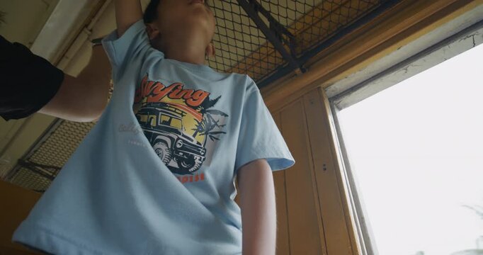 Little asian boy enjoy travel in local old train backpacker kids Thailand