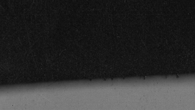 Fast rewind of extreme close-up vintage x-ray radiograph scan textures. Seamless looping grunge film overlay with dust, scratches and noise.