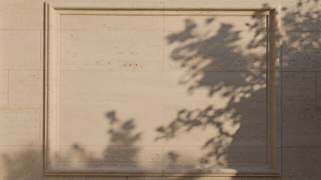 Natural tree leaf shadow dancing on beige travertine stone wall with molding under bright sunlight, perfect for background, texture, and concept videos