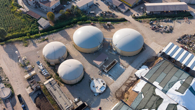 Aerial view of large anaerobic digesters at an agricultural complex in Mediglia, Lombardy, Italy.