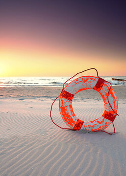 Peaceful Baltic Coast with a Lifebuoy at Sunset