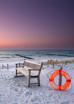 Dreamlike Baltic Sea Beach with Empty Bench and Lifesaver
