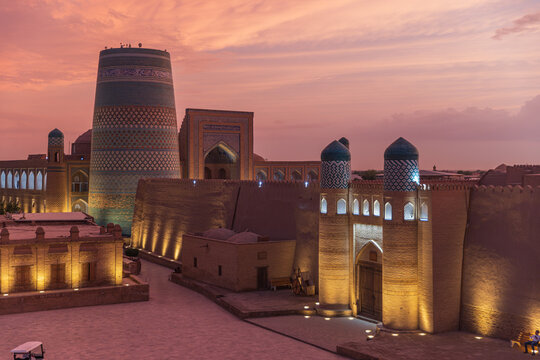 Kalta Minor Minaret and Ancient City Walls of Itchan Kala at Sunset in Khiva, Uzbekistan