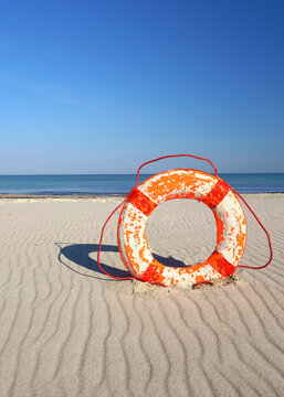 old rustic life buoy on the beach