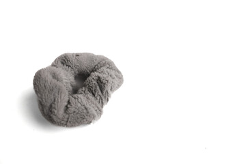 Fototapeta premium Gray Fluffy Hair Scrunchie on White Background, Close-Up Shot