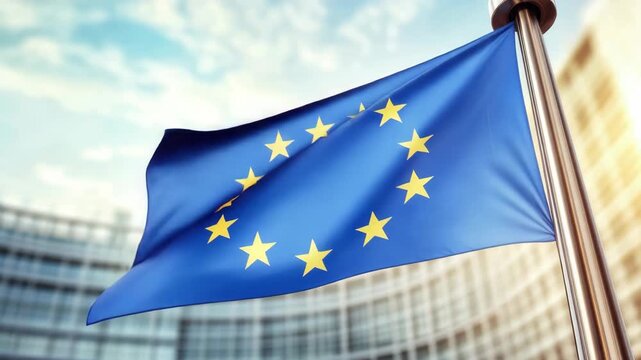 European Union Flag Waving on a Pole with Blurred Building Background
