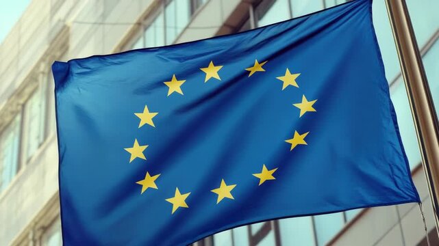 European Union Flag Waving in Front of a Modern Building