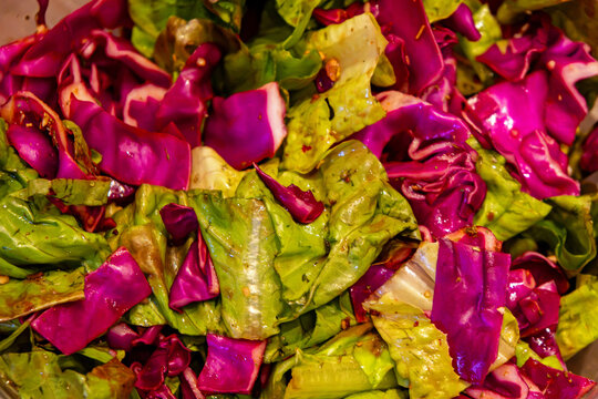 Fresh organic colourful leaf salad background spiced up for eating
