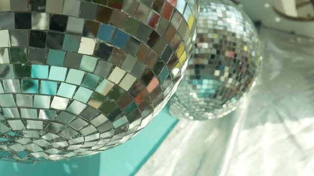 disco ball with mirror tiles creates sparkling light for new year party. festive new year background with copy space for text. perfect new year decoration for holiday event intro