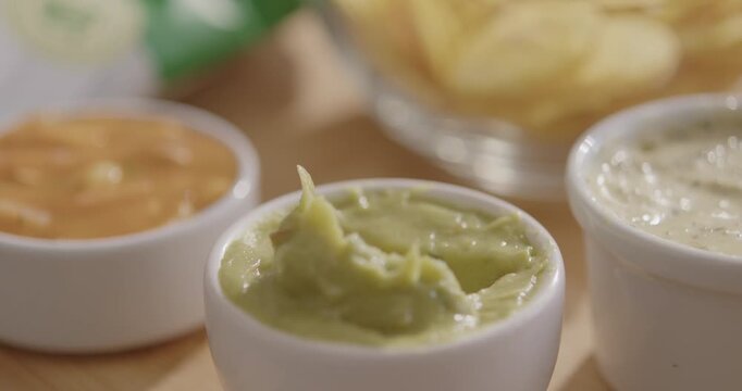 Plantain Chips Dipping into Sauce - Appetizing Snack Video