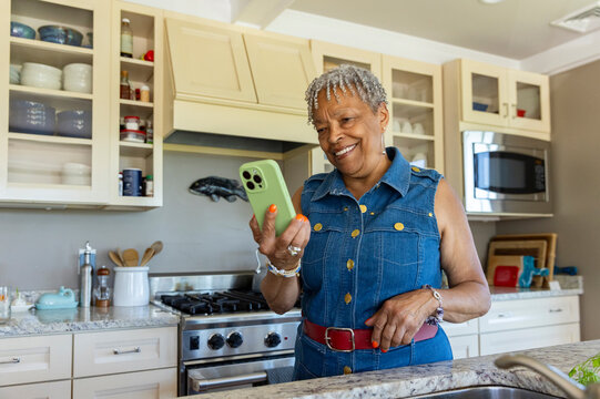 Portrait Black woman cell  phone at home
