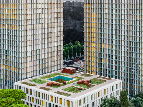 Aerial view of the modern office buildings and green roof terrace in the EUR district of Rome, Lazio, Italy.