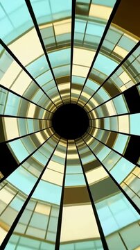 Vertical video: Rotating rings shifting when panes moving at atrium with dark void and dividers