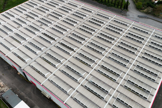 Aerial view of the roof of the Centrale Termoelettrica Santa Barbara Enel, featuring rows of skylights and industrial architecture in Santa Barbara, Toscana, Italy.