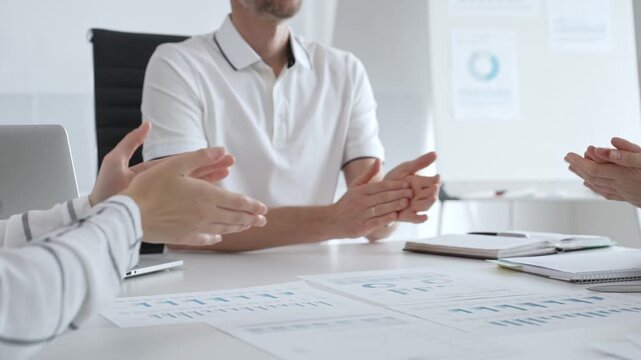 Professional team members applauding enthusiastically, displaying collaborative spirit and mutual recognition after delivering compelling presentation in corporate workspace