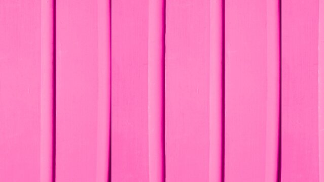 Vibrant pink wooden planks for background and exterior wall design