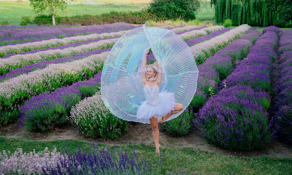 A ballerina dancing gracefully in a lavender field on a flower farm