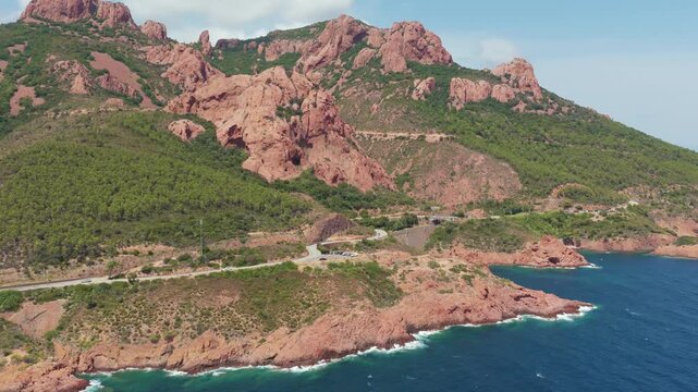 View of red coast by the blue sea drone video Cap Roux France 4K