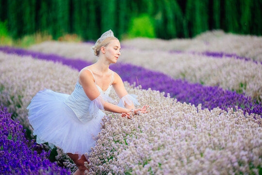 A ballerina gracefully poses in a lavender flower field in WA, USA
