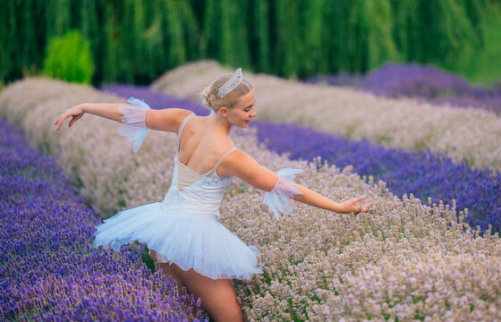 A ballerina dances gracefully in a lavender flower field in WA, USA