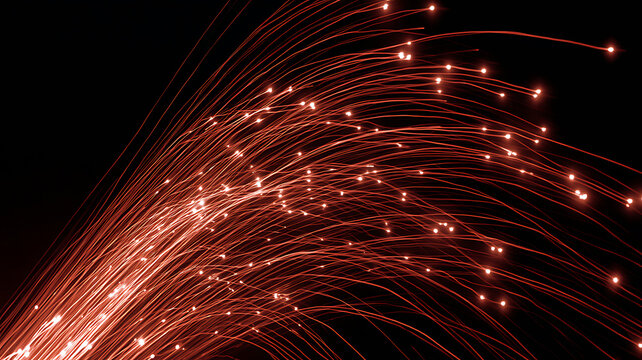 Illuminated red fiber optic cables glowing in the dark, symbolizing telecommunication and data