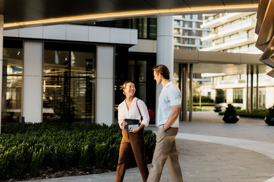 Enjoying a sunny afternoon stroll in a modern urban setting