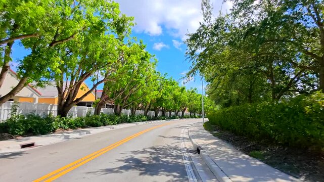 Residential tree lined streets of Weston Florida Sunset Springs Way