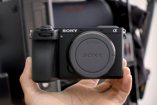 Zapopan Jalisco, Mexico - May15 2026: Hand holding Sony Alpha 6700 mirrorless camera body, sony camera concept