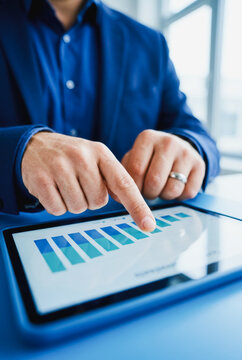 Business professional analyzing data on a tablet
