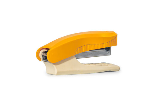 Vintage yellow stapler with open lid, isolated on white background. Retro office supplies.