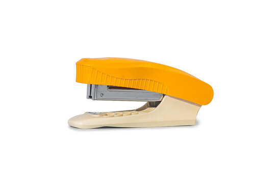 Vintage yellow stapler with open lid, isolated on white background. Retro office supplies.