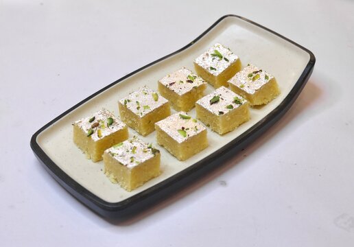 Barfi beautifully served on a white plate