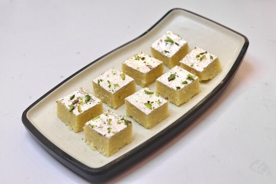 Barfi beautifully served on a white plate