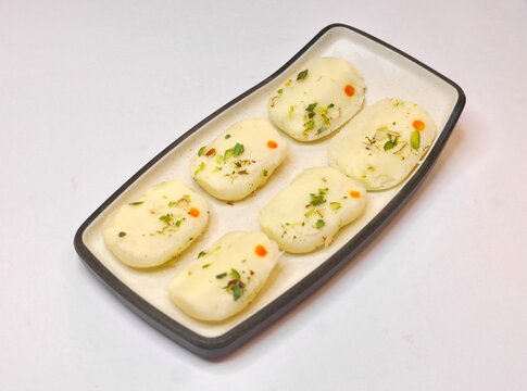 Malai cham cham made with chena and khoya garnished with pistachios 
