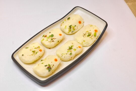 Malai cham cham made with chena and khoya garnished with pistachios 