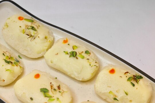 Malai cham cham made with chena and khoya garnished with pistachios 