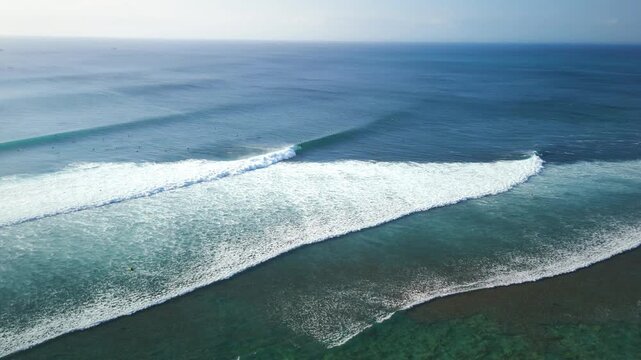 Drone view with ocean waves in ocean on Impossibles beach, perfect surfing swell wave