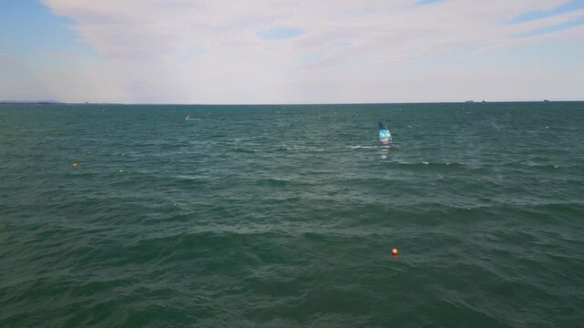 Windsurfer Riding Waves in Open Sea, Windsurfing Extreme Sport Activity