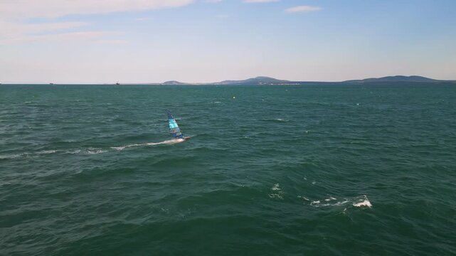 Windsurfer Riding Waves in Open Sea, Windsurfing Extreme Sport Activity