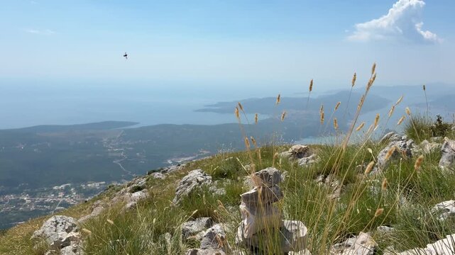 Majestic mountains overlooking the blue sea on a sunny summer day, scenic Mediterranean coastal landscape under a clear sky