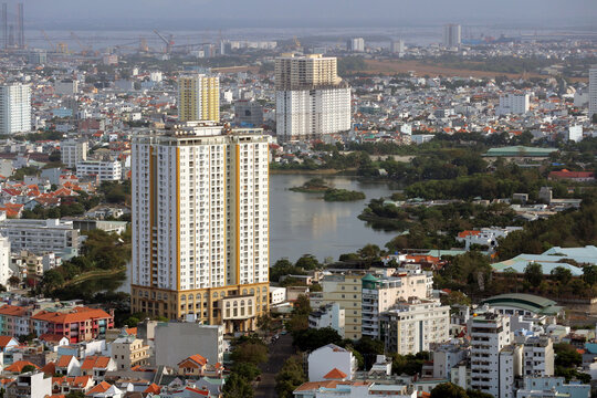High angle view of a modern apartment building near Bau Sen lake in Vung Tau cityscape.