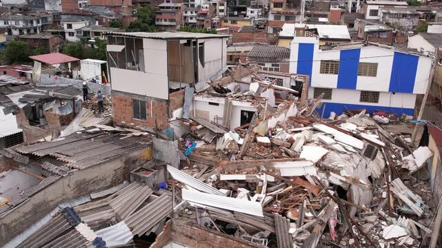 Aerial drone view of severely damaged houses, rubble, and collapsed roofs in the Grisales neighborhood, Quimbaya, Quindio, Colombia, following the August 2026 earthquake