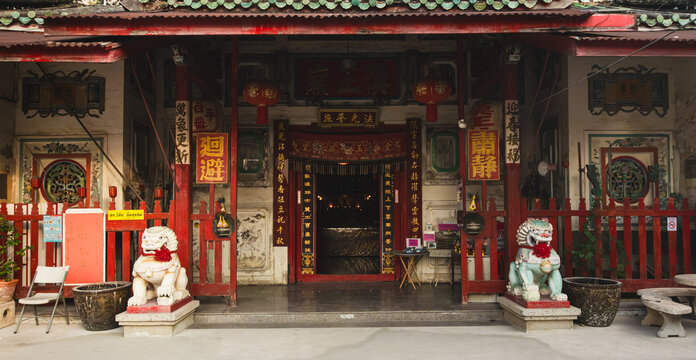 Traditional Chinese Han Wang Temple Entrance with Stone Guardian Lions and Red Lanterns in Talat Noi Bangkok Thailand