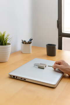 Vertical cybersecurity concept with laptop padlock and key