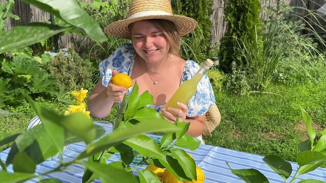 Young woman with dark hair smiles genuinely while gardening outdoors, surrounded by lush greenery and bright daylight, capturing a peaceful moment of nature connection
